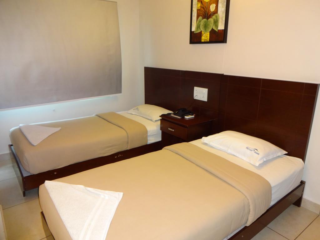 Hotel Sky Lite Коямпутур Номер фото
